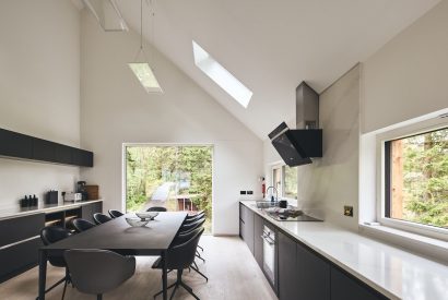 The kitchen and dining table at Munro Cabin, Loch Lomond
