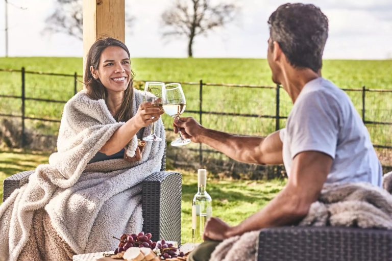 A couple having a glass of wine in the garden
