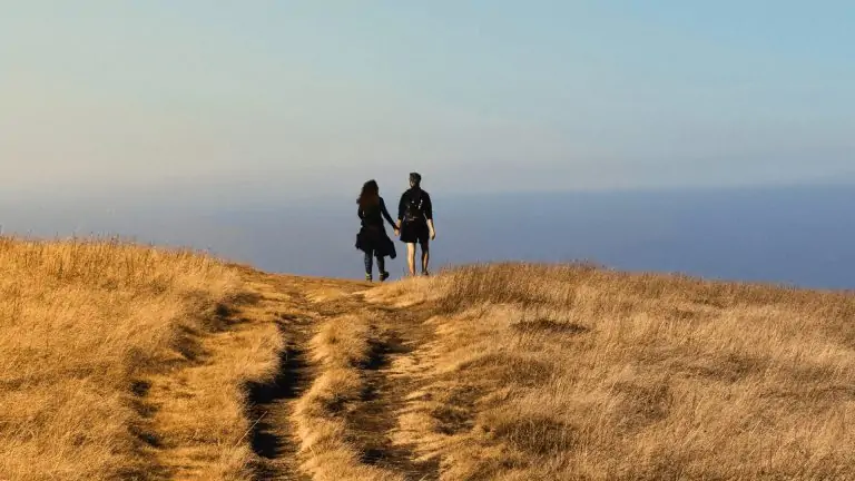 Happy couple on honeymoon walking