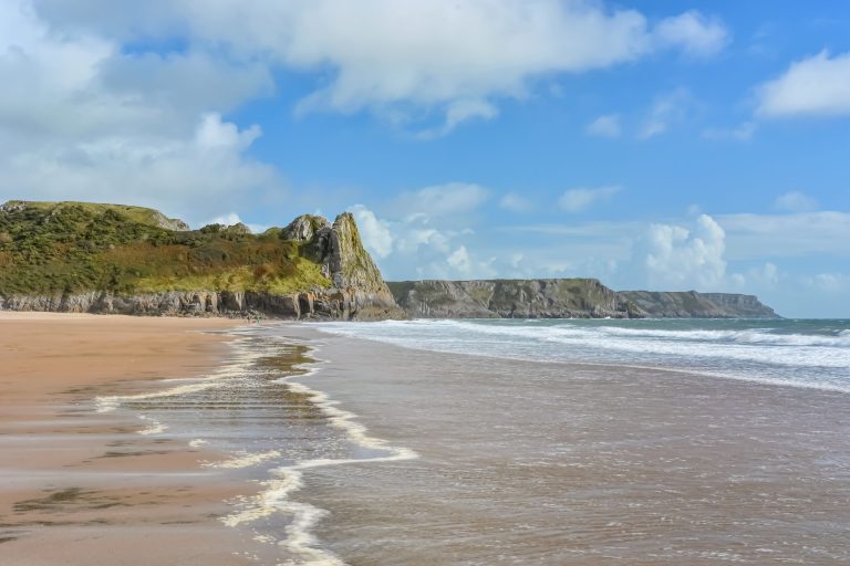 Sands and cliffs at the Eastern End Of Oxwich Bay Beach On The Gower Peninsula In Wales