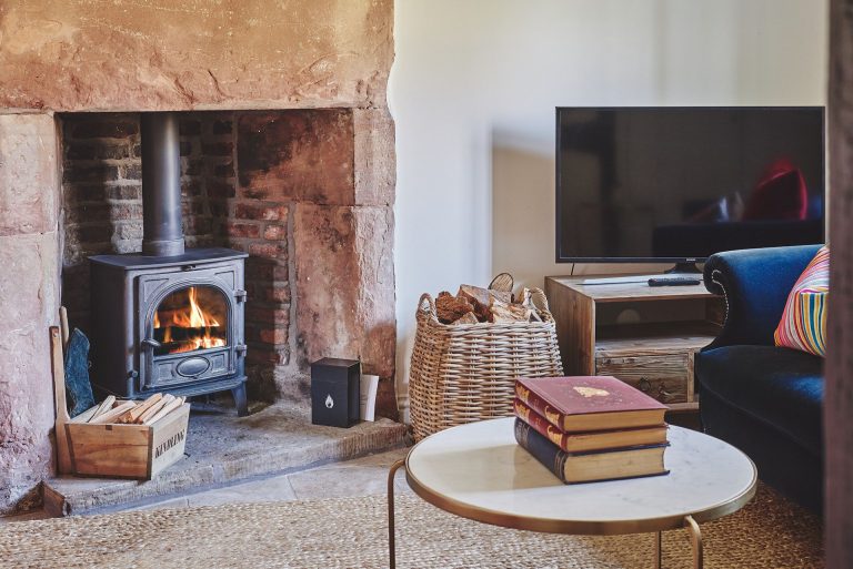 fireplace in living room of Lakeside Cottage in Cheshire