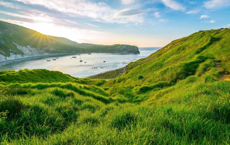 Boats on the sea at Lulworth Cove