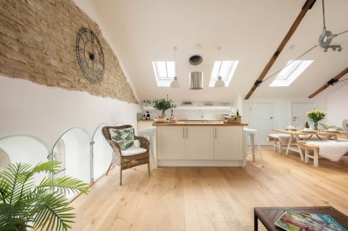 Luxury Penthouse suite with living area with exposed brickwork